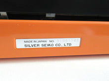 UpperDutch:Typewriter,Silver-Reed 100 working typewriter made in 1976. 1970's Orange typewriter, Silver Seiko Co Japanese QWERTY writing machine
