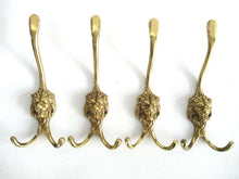UpperDutch:,Set of 4 Brass Lion Head Wall hooks, Coat hooks. Decorative animal storage solution, coat hangers. Ornate wall fixtures.
